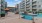 a pool in a courtyard between buildings