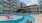 a pool with a building in the background