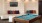 a pool table in a room with a tv