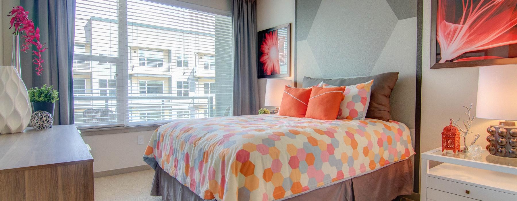 a bedroom with a large window