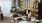 a living room with a table and chairs