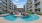 a pool in a courtyard between buildings