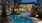 a pool in a courtyard between buildings