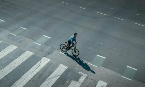 Find your perfect fit at Veranda Highpointe a person riding a bicycle on a street