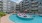 a pool in a courtyard between buildings