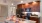 a kitchen with wooden cabinets