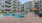 a pool in a courtyard with buildings around it